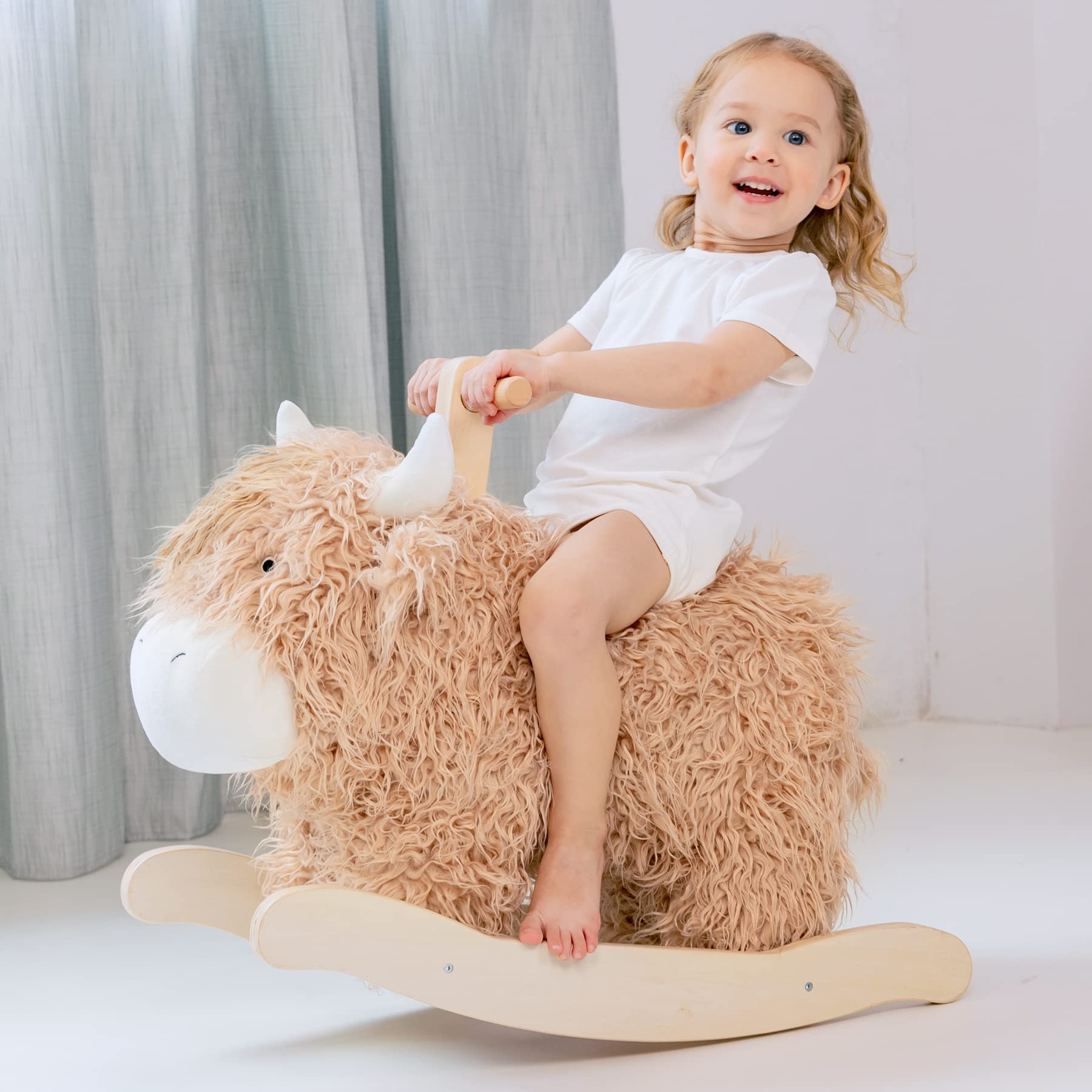 JOLIE VALLÉE TOYS wooden cow rocking horse for toddlers; inviting nursery play.