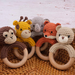 Joliecraft woodland nursery decor image shows adorable beige bear rattle.