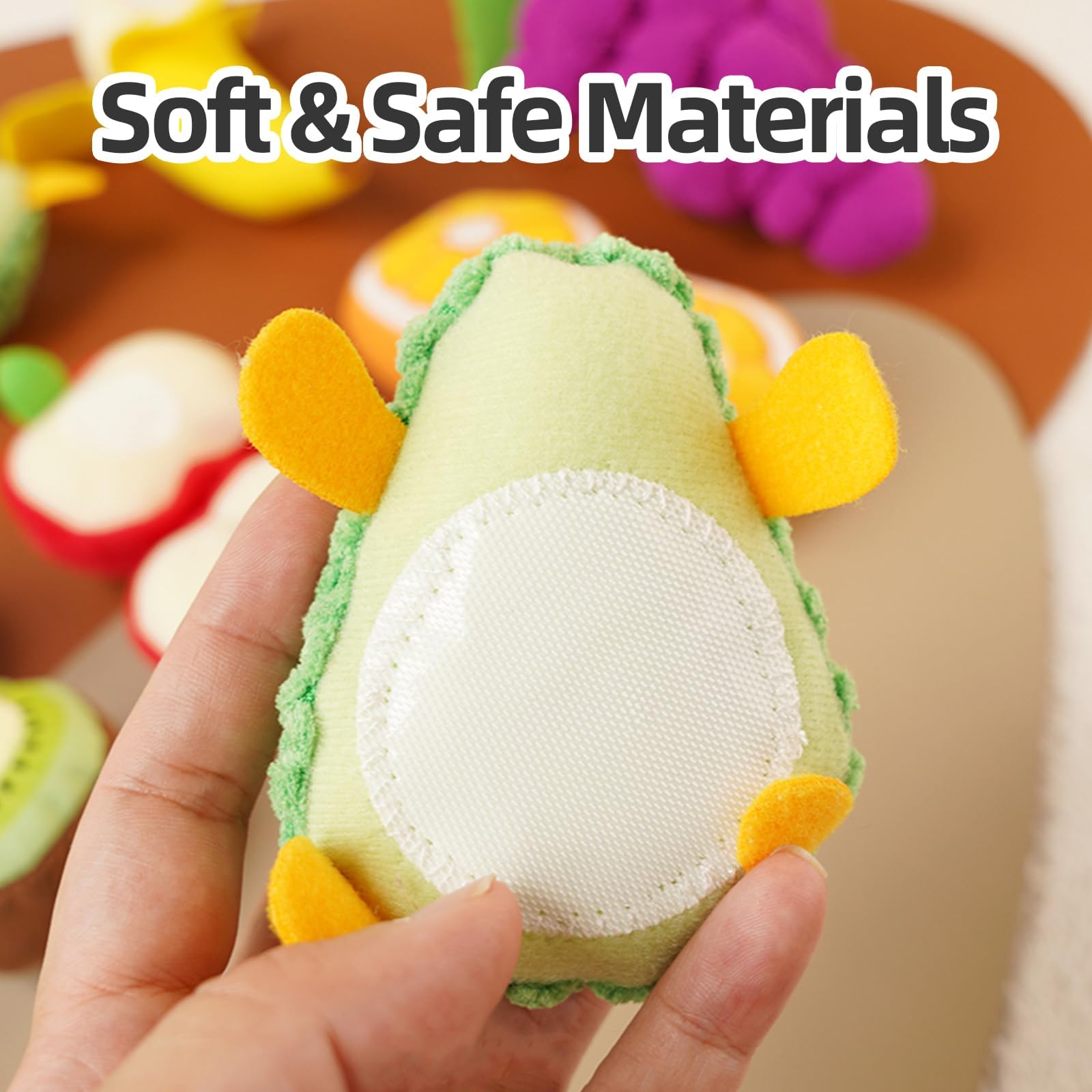 Jollybaby orange plush fruit helps develop fine motor skills during pretend meals.