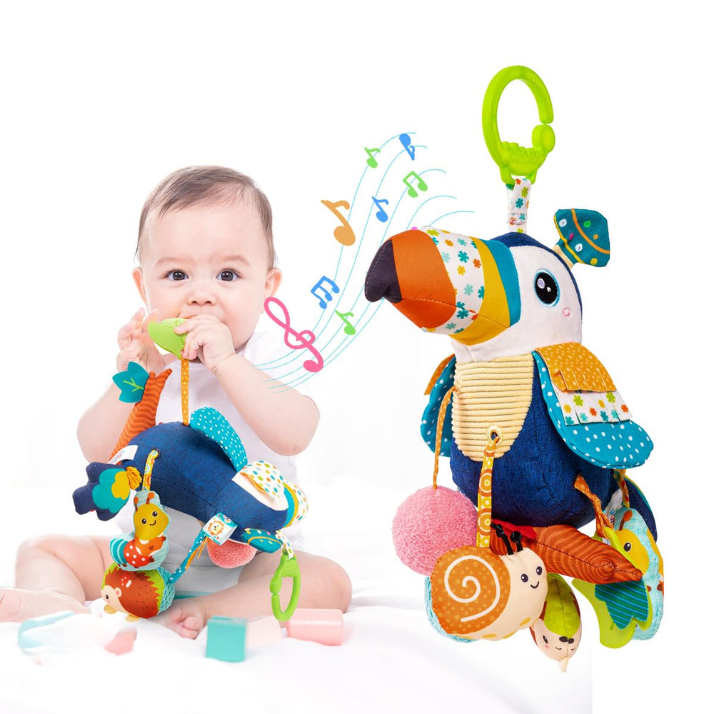 Jollybaby toucan musical hanging toy attached to car seat, promotes visual tracking and soothing sounds.
