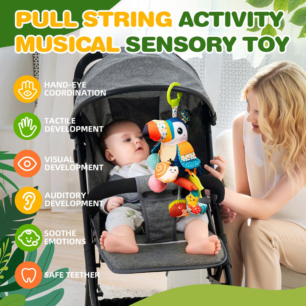 Jollybaby toucan hanging toy on stroller clip supports grasping and hand-eye coordination.