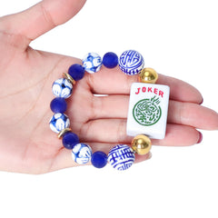 Jongyance Mahjong tile charm close-up in blue shows detailed engraving