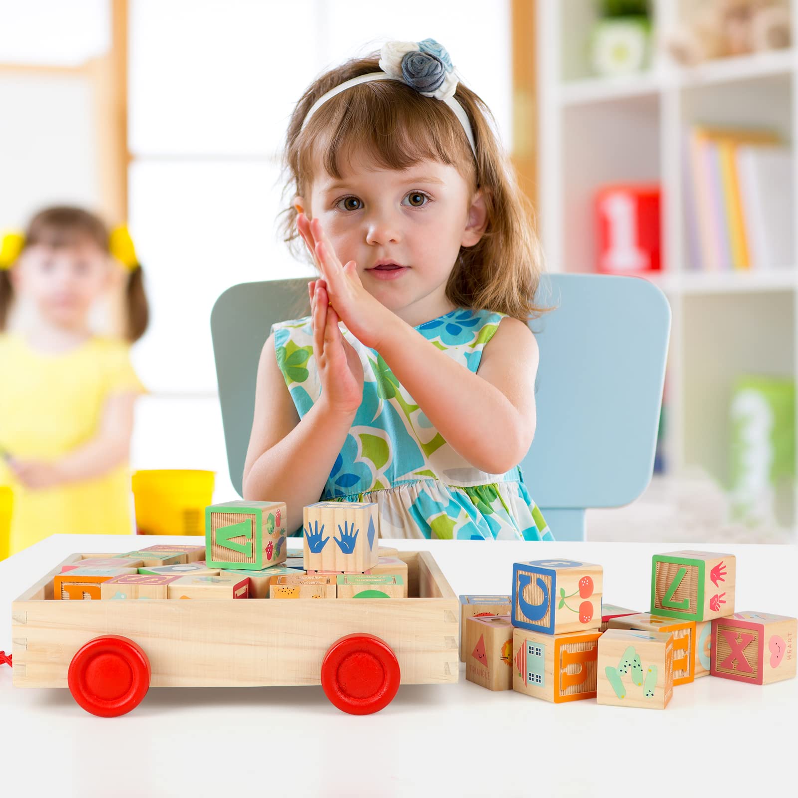 Close-up of Joqutoys alphabet blocks showing uppercase and lowercase sides.