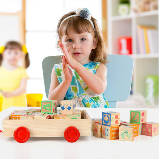 Close-up of Joqutoys alphabet blocks showing uppercase and lowercase sides.