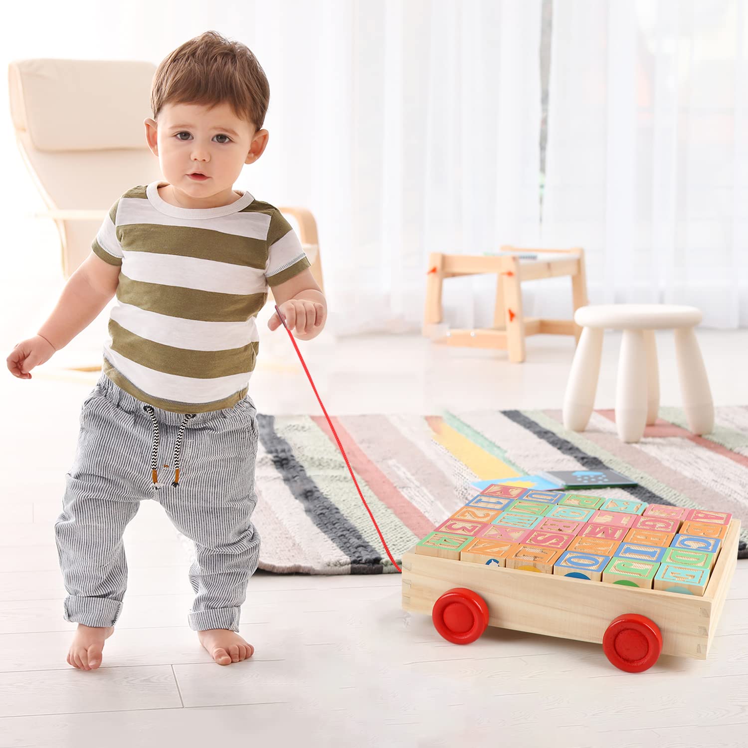Blocks being stacked by a child for creative building with Joqutoys set.
