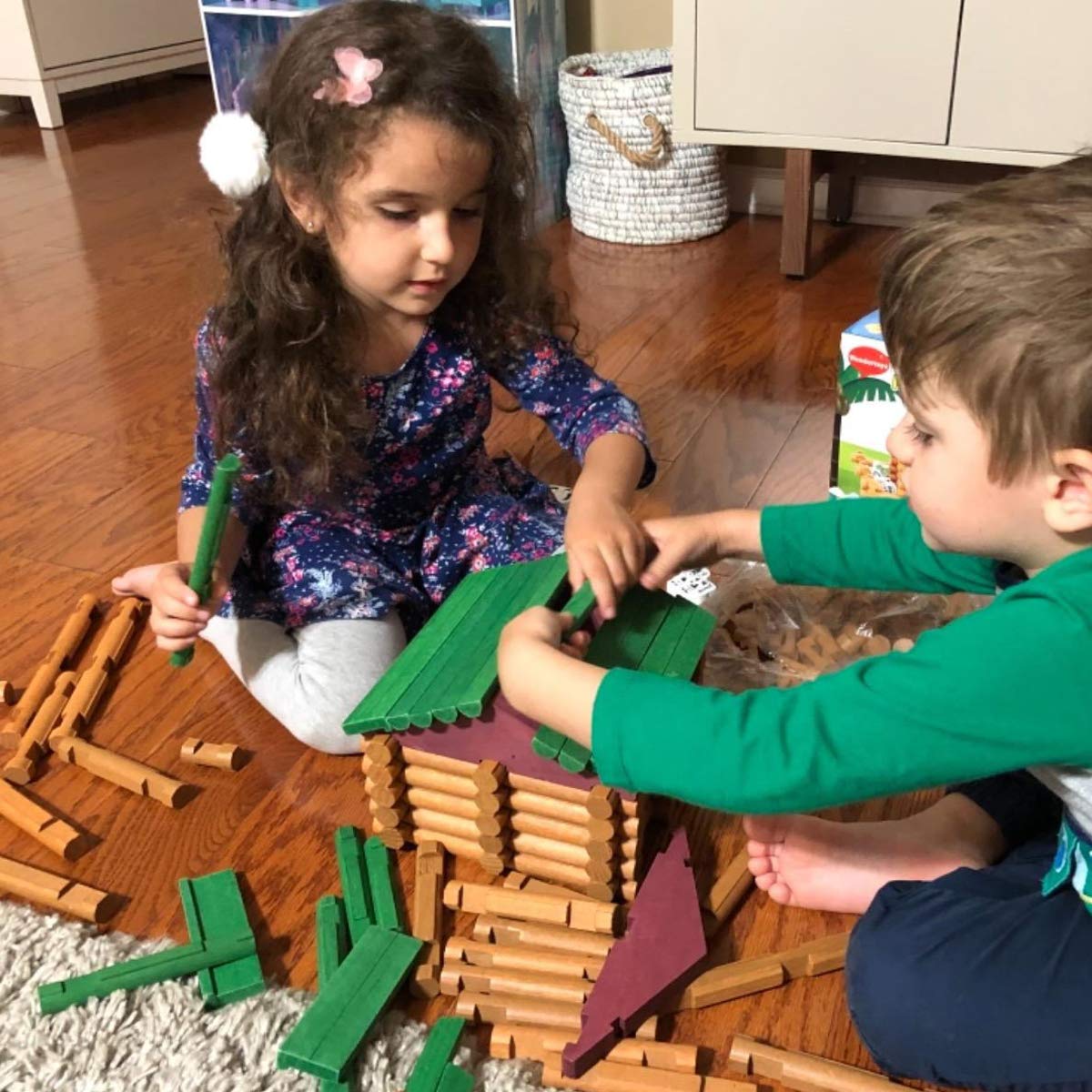 Joqutoys log cabin build guide supports creative construction in kids.