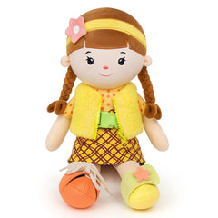 Jumbrace plush doll in yellow dress hugging a child for bedtime comfort