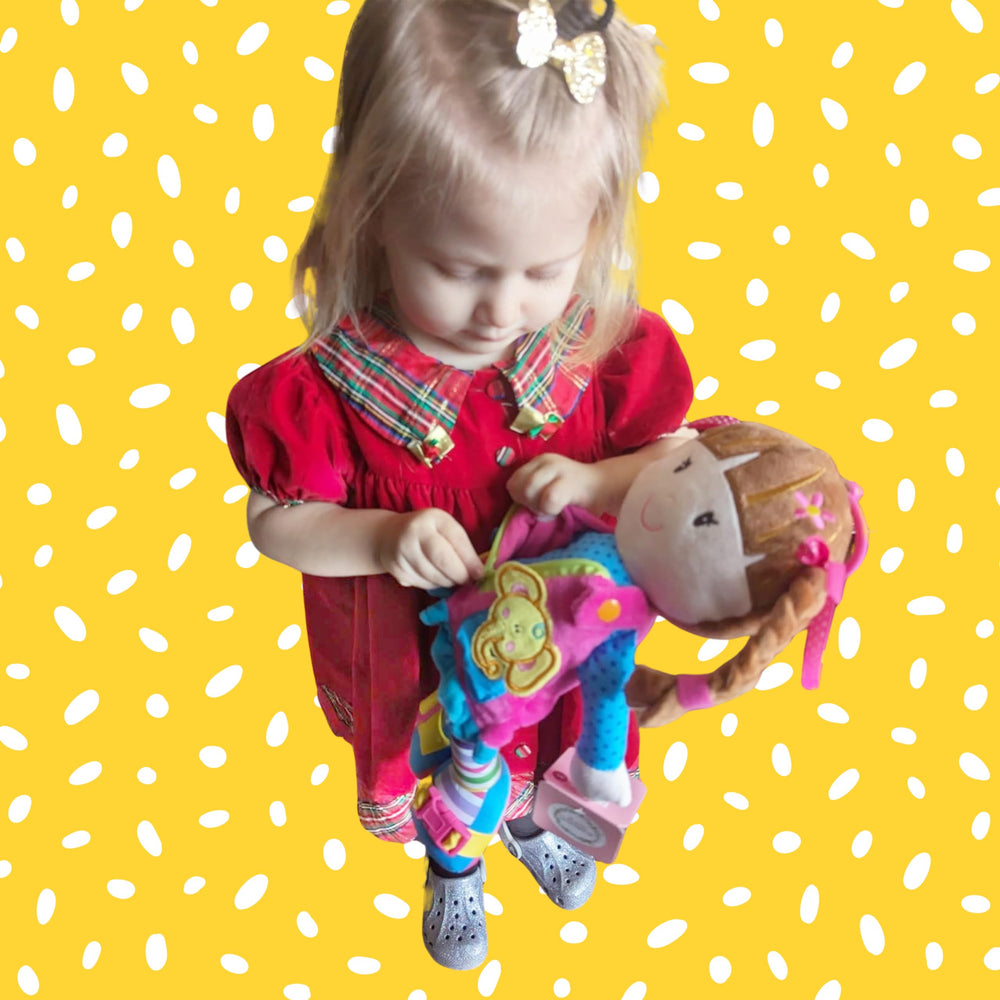 June Garden Belle plush supports sensory and motor development during pretend dressing