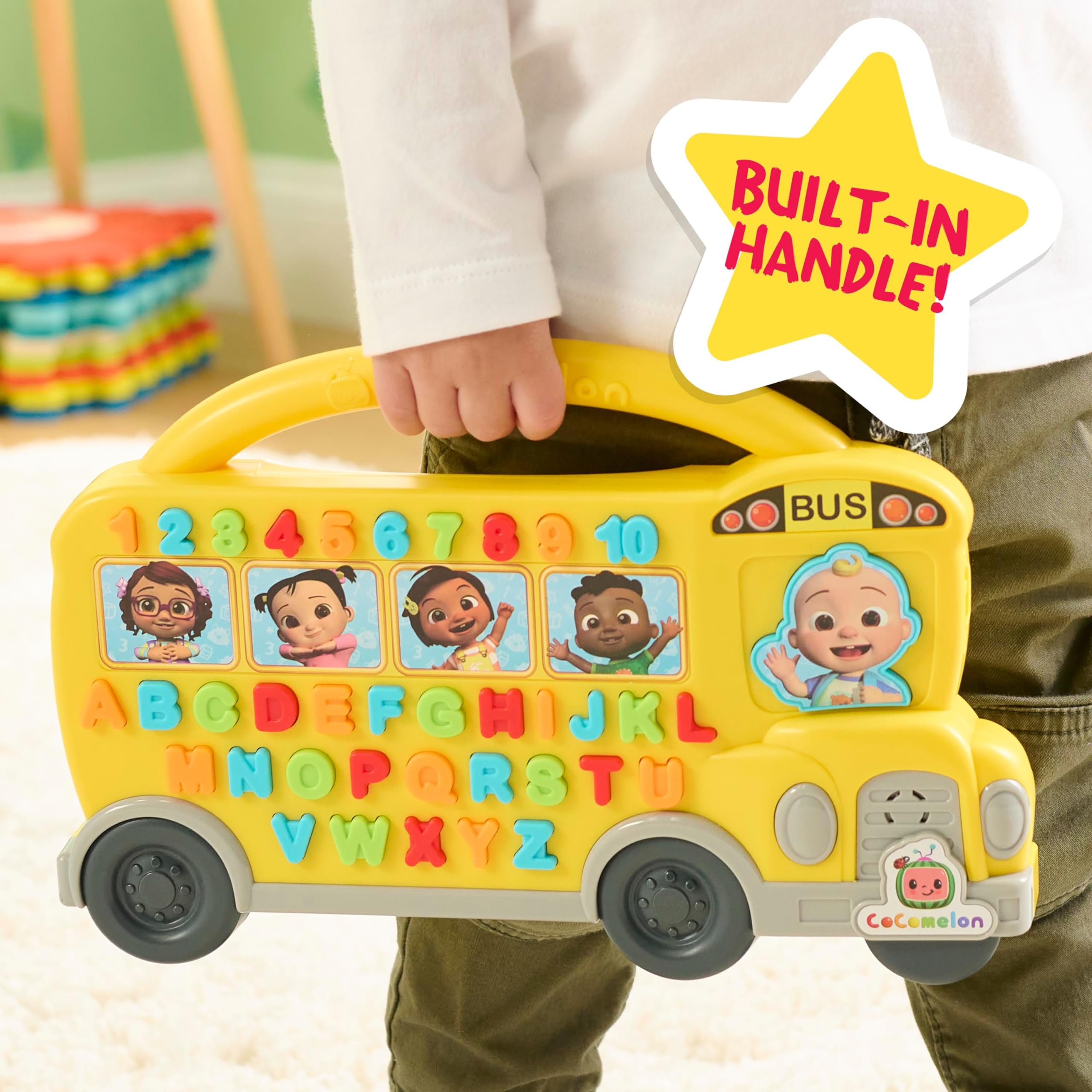 Just Play Cocomelon Learning Bus JJ driver button activates songs for interactive play.