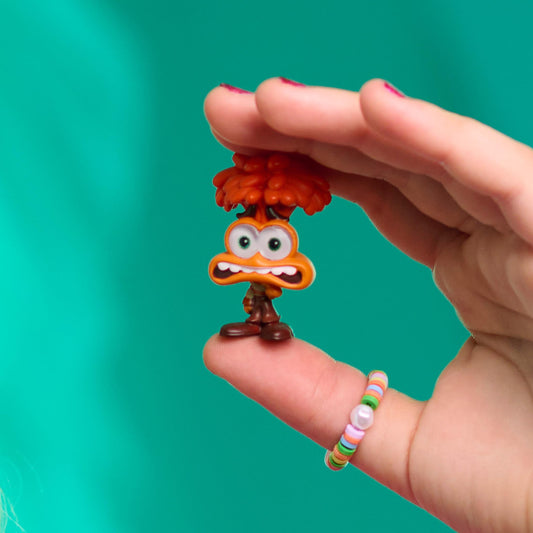 Just Play Disney Doorables Inside Out 2 Joy figure highlights a sparkly-eyed character for imaginative play.