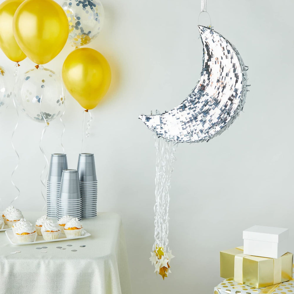 Juvale moon pinata features silver foil finish and gold star strings for elegant decor