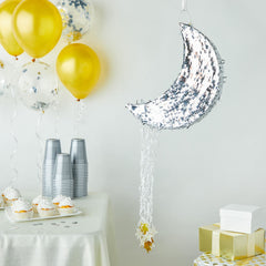 Juvale moon pinata features silver foil finish and gold star strings for elegant decor