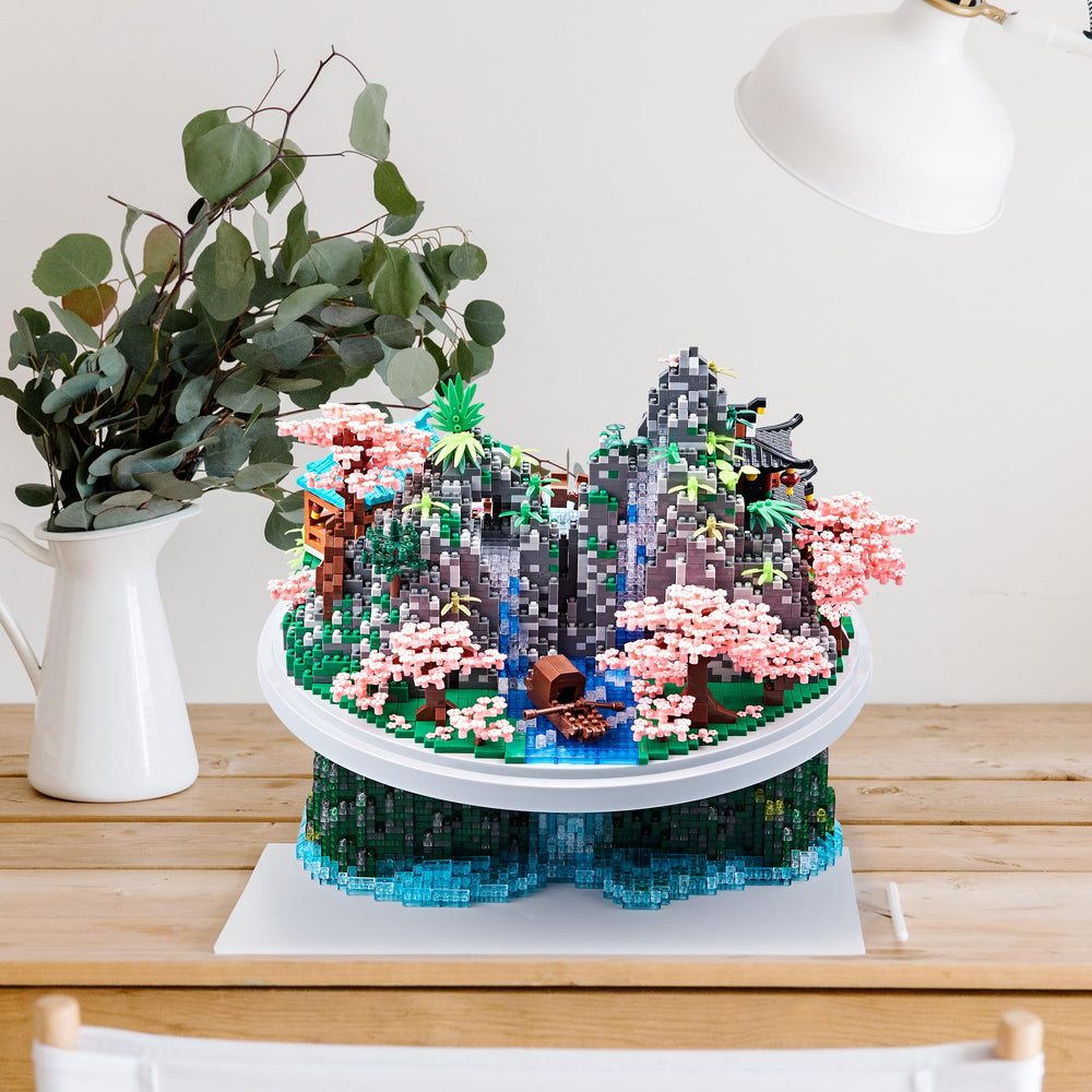 JXRLMB Alpine peach blossoms detail enhances miniature architectural realism.