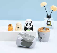 Kakeah long-nosed elephant nesting dolls wood texture shot highlights natural Linden wood.