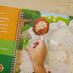 KangaToys child placing stickers scene to boost fine motor skills.