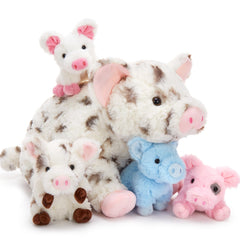 Karister kids cuddling with the pig family during play