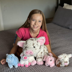 Karister pig family plush in different poses for playtime