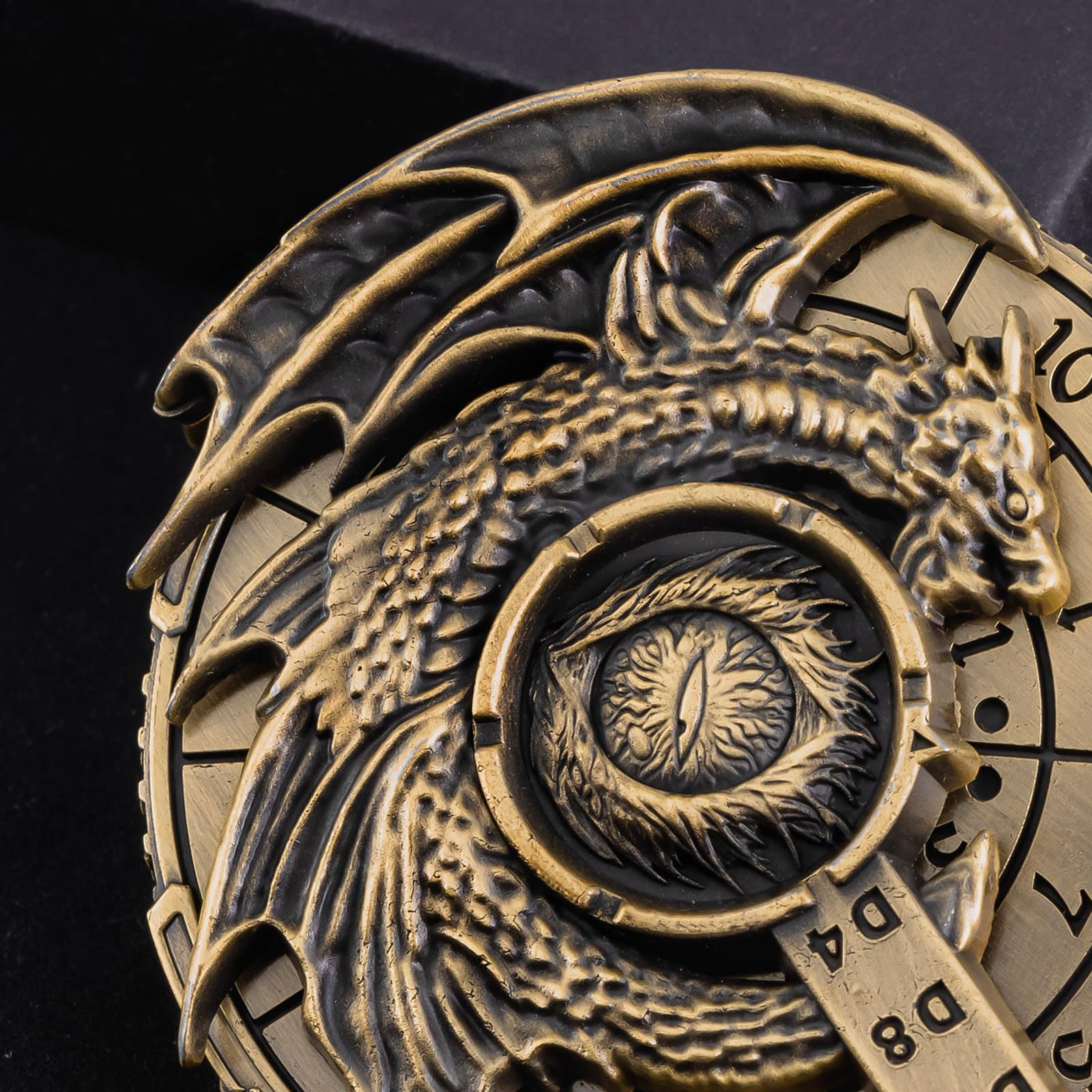 Close-up of the dragon engraving on the dice for table presence
