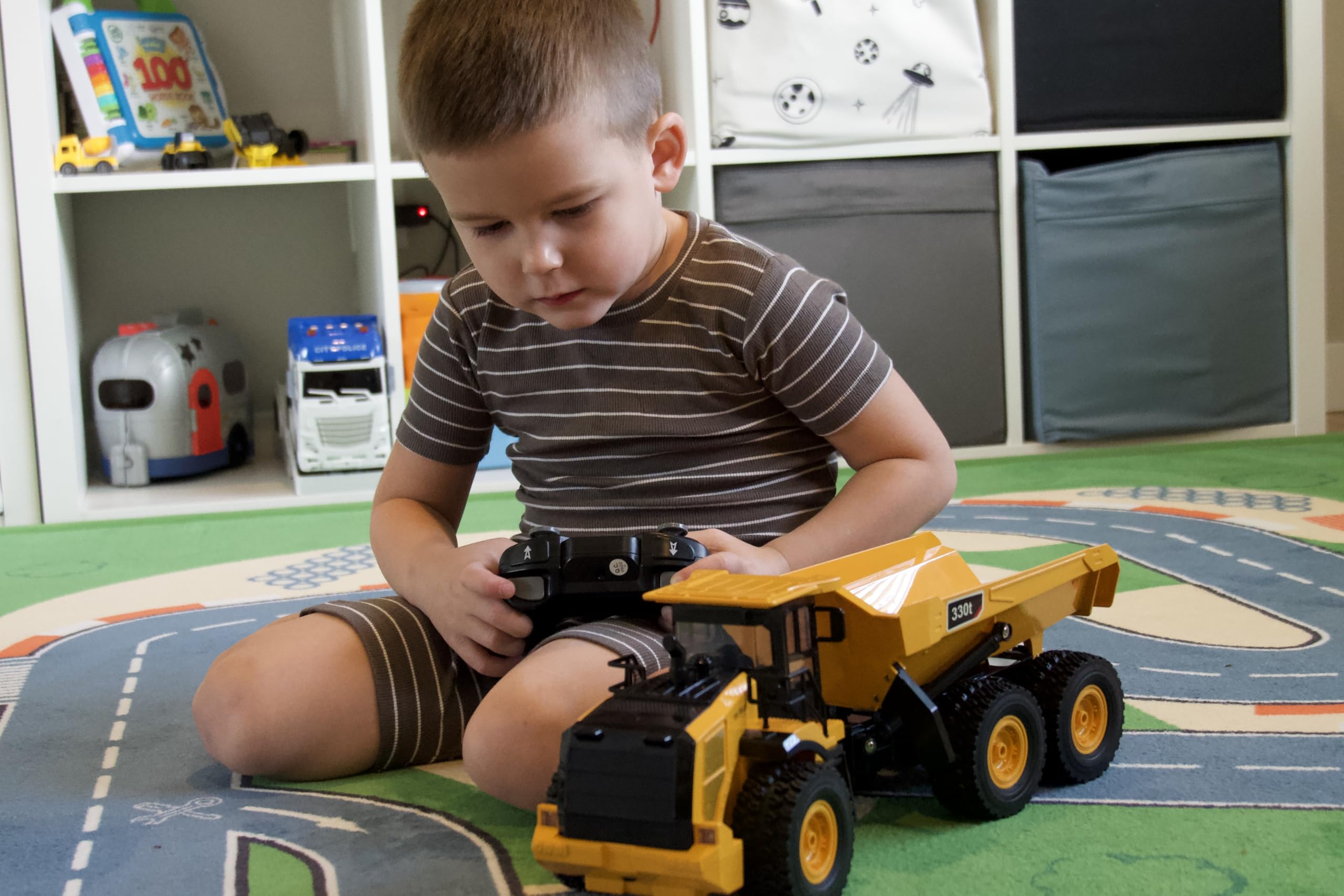 KIDDITOY Mighty 9-Channel RC Dump Truck six wheels on rugged ground