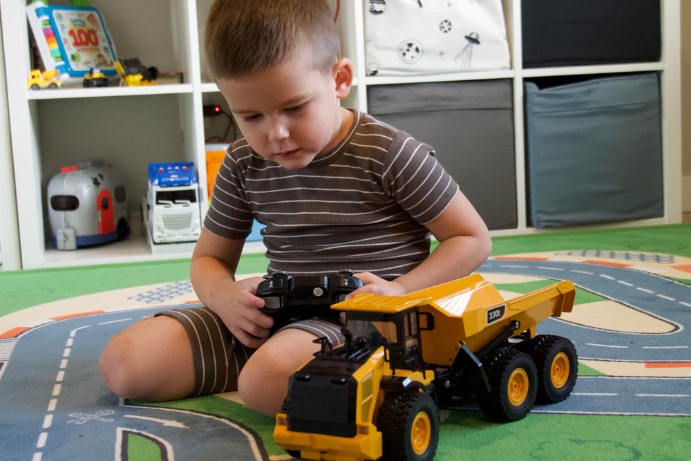 KIDDITOY Mighty 9-Channel RC Dump Truck six wheels on rugged ground