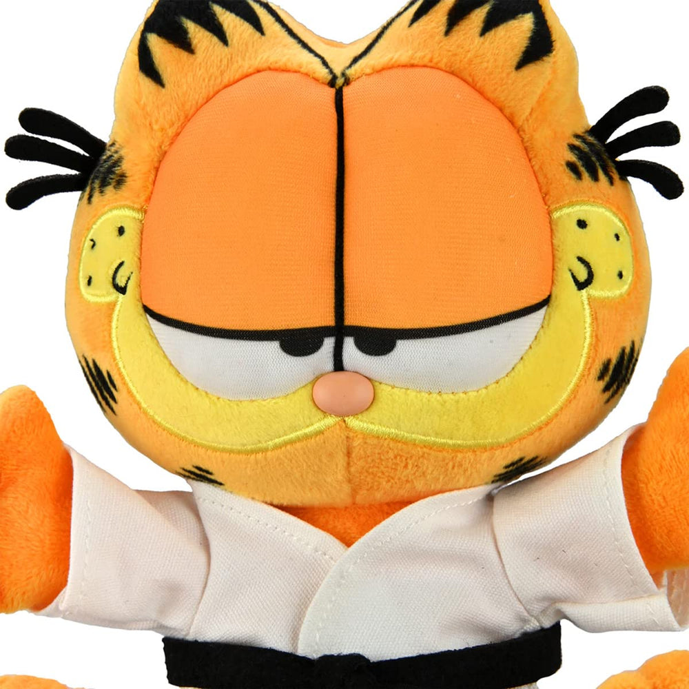 Kidrobot Garfield karate gi plush on desk, cozy display for work or study.
