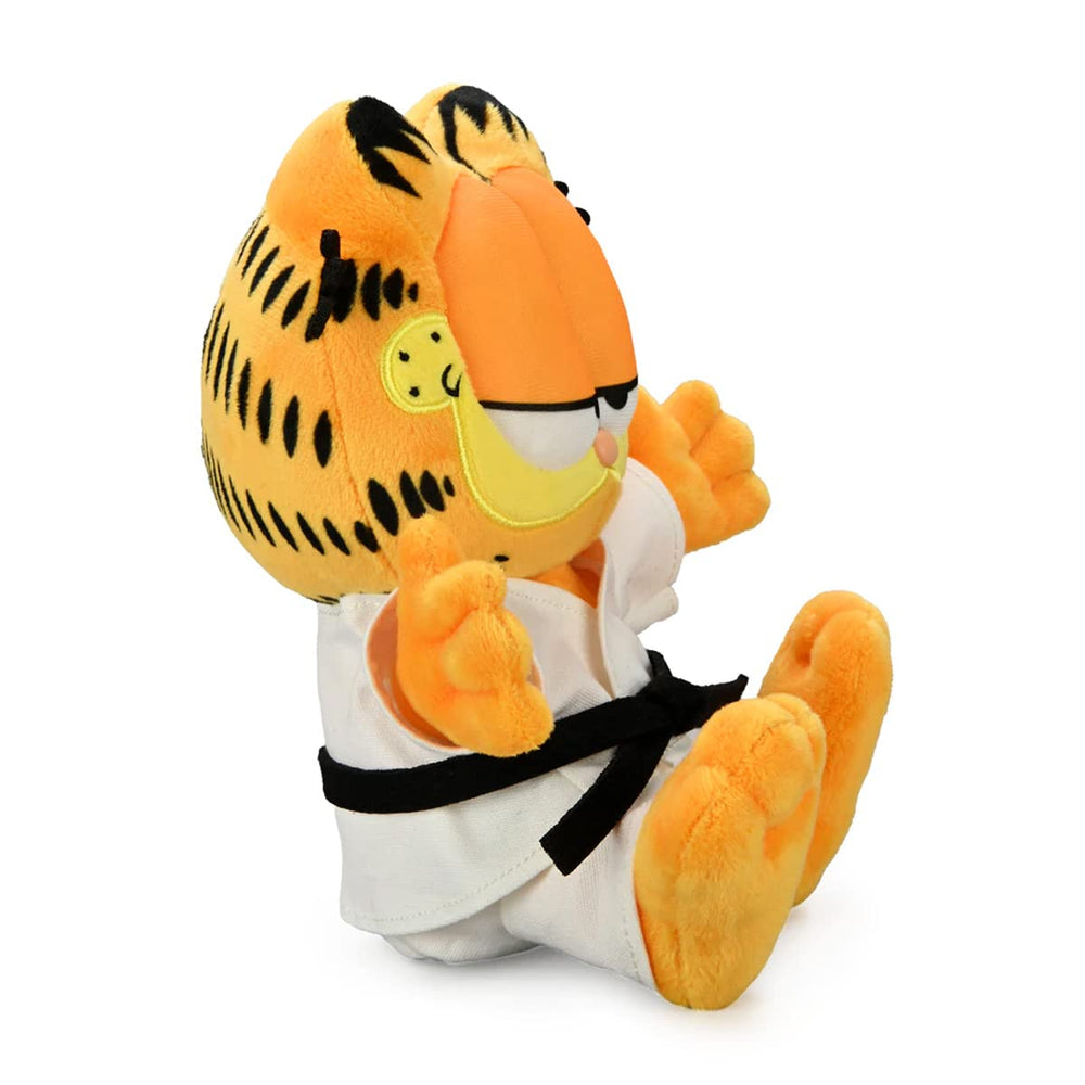 Kidrobot Garfield karate gi plush on shelf, cute licensed collectible piece.