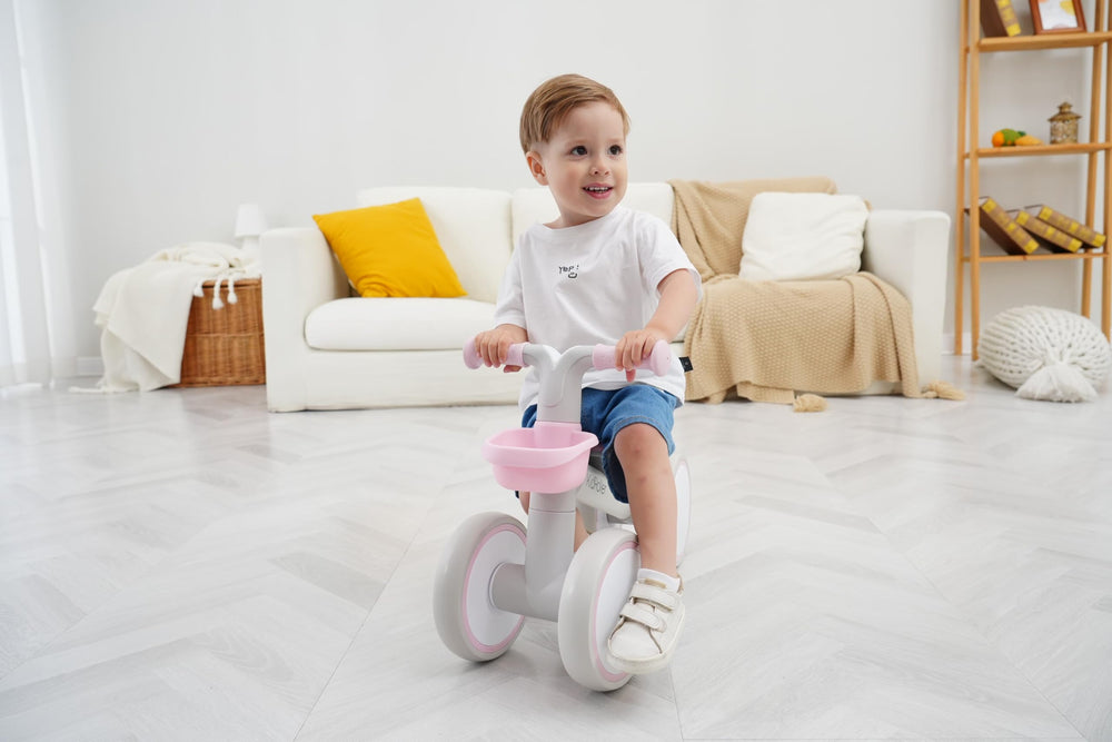 Close-up of pink KidRoller balance bike front angle showing safety features.