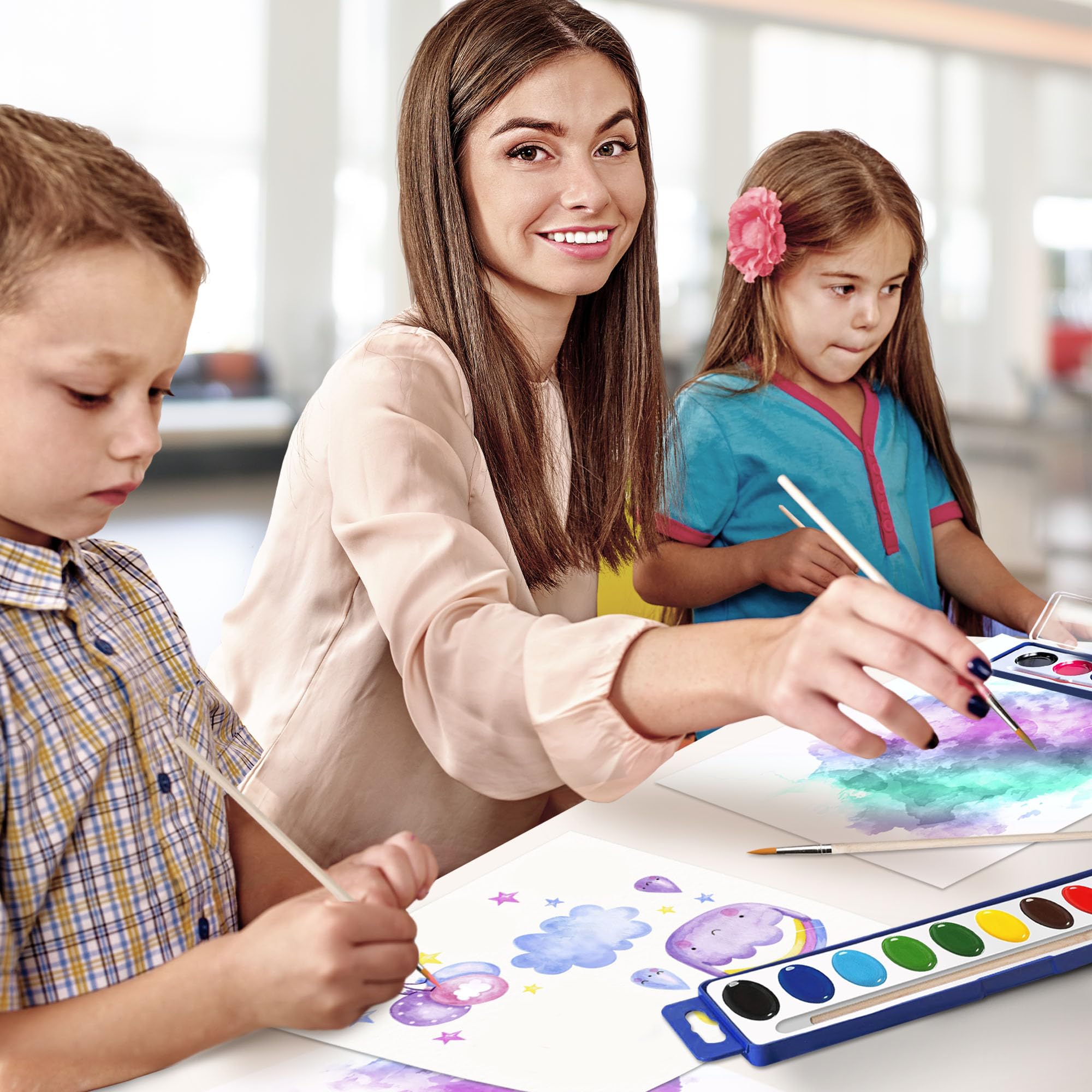 Kiggos kids painting session using colorful watercolors for imaginative landscapes.