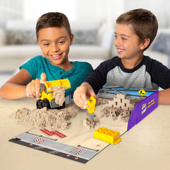 Kinetic Sand Dig N' Demolish brick mold builds walls with satisfying texture.