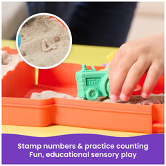 Kinetic Sand tractor rolling numbers in sand to practice counting