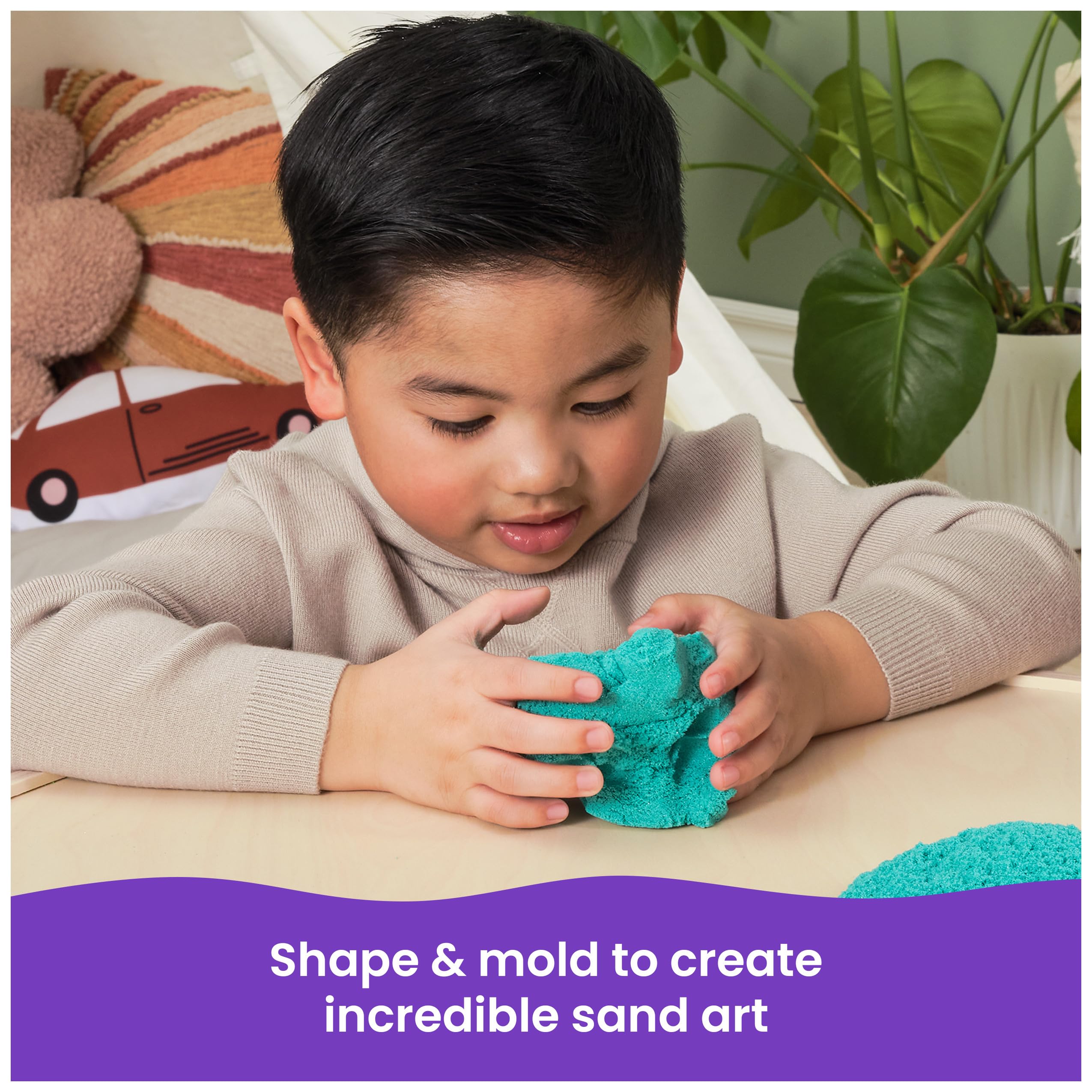 Kinetic Sand Twinkly Teal glittering surface enables sparkly sand art projects.