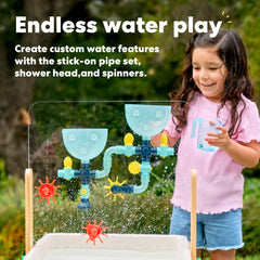 KiwiCo water and sand sensory table clear panel invites doodling and path tracing along pipes.
