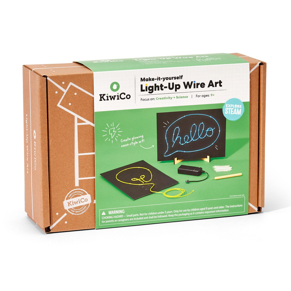 Two neon-style signs lit up using KiwiCo kit components