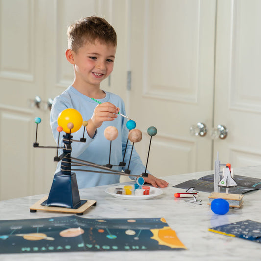 KiwiCo Astronaut Starter Kit model planets invite kids to paint and spin a mini solar system.
