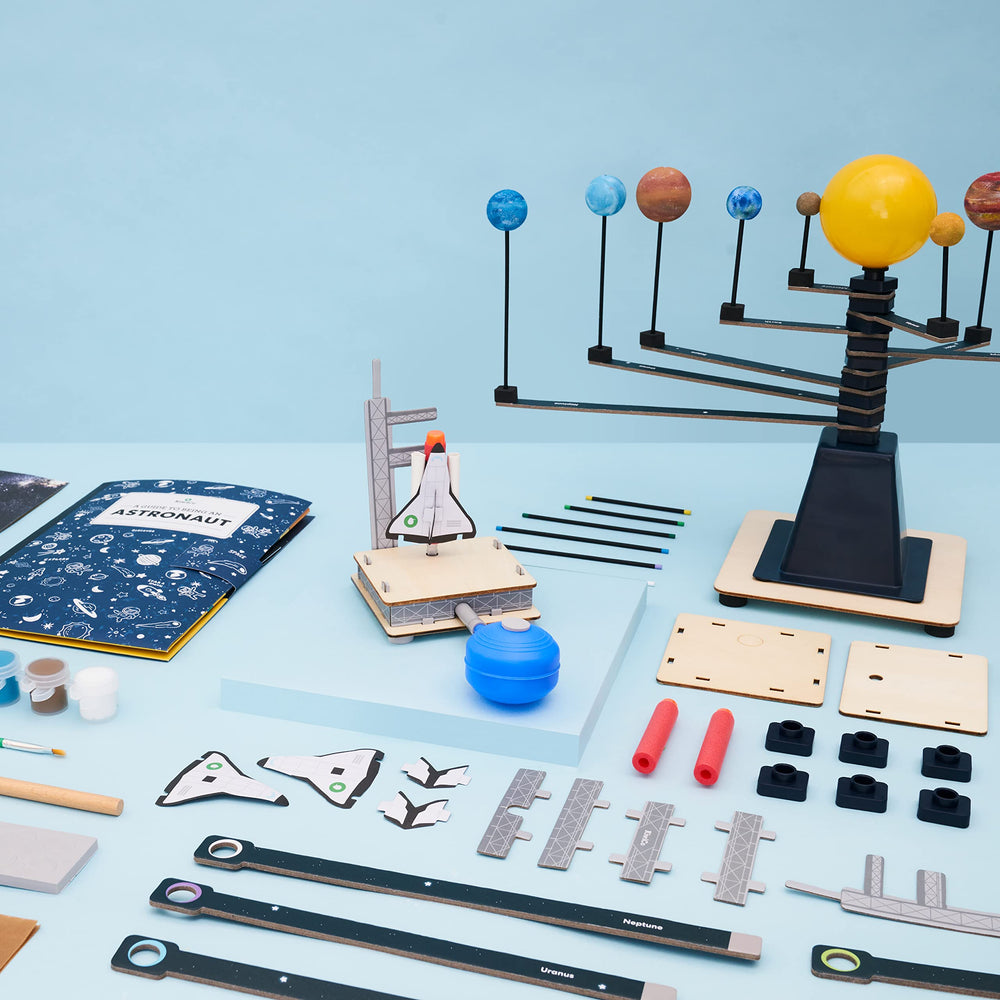 KiwiCo Astronaut Starter Kit spinning solar system helps visualize orbits and gravity concepts.