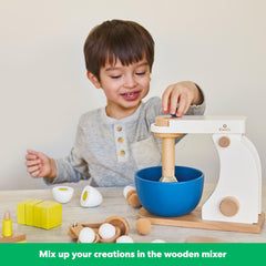 KiwiCo Bake-a-Cake Stand Mixer candle-topped cake image, adding storytelling to pretend celebrations.