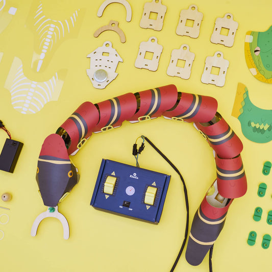 KiwiCo snake robot navigating a maze for practical debugging and problem solving.