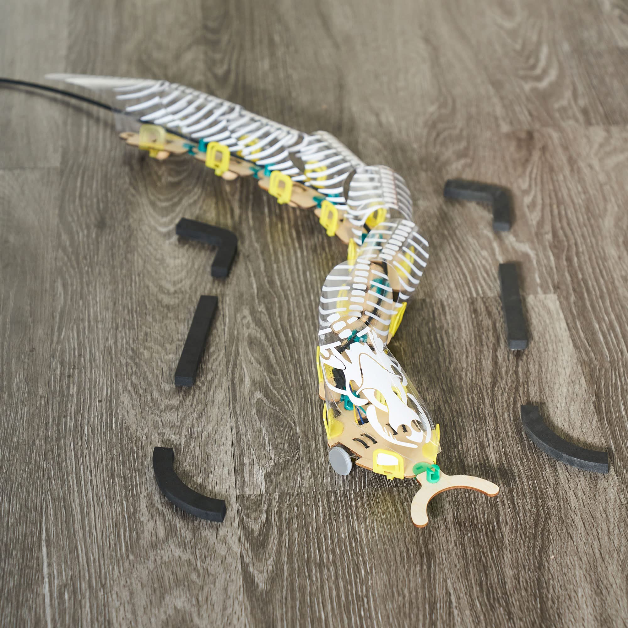 KiwiCo explanation of how switches cause side-to-side motion in the snake.
