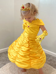 Knemmy Princess Dress Yellow brooch detail close-up showcasing hand-stitched accent and party-ready appeal.