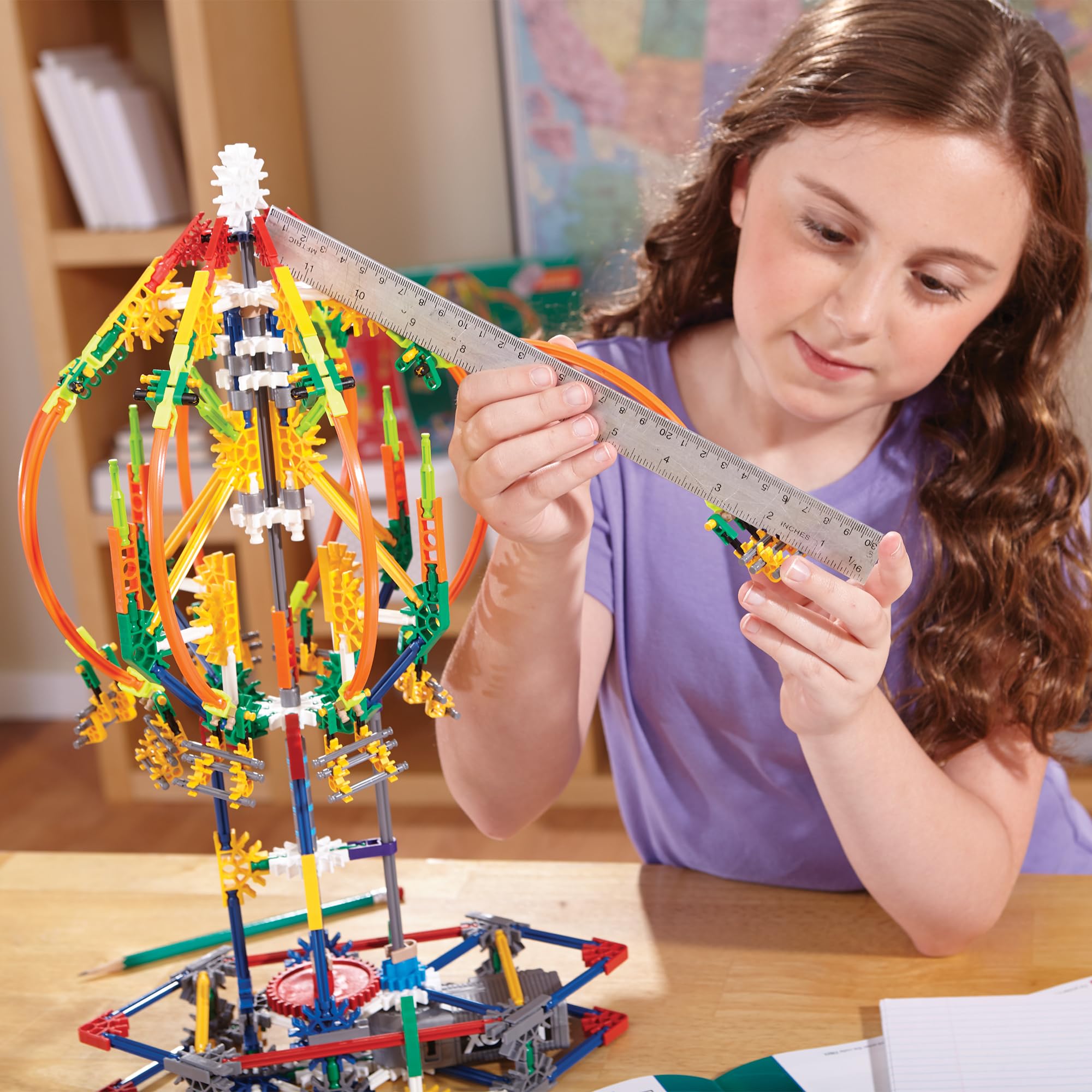 K'NEX motor-powered action shows a functioning ride powered by two AA batteries.
