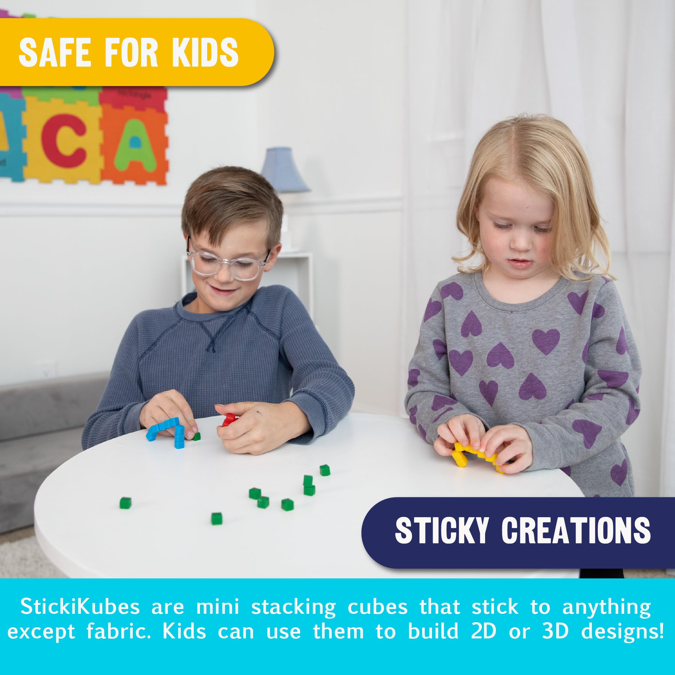 KOMARC GAMES StickiKubes on a wall demonstrate easy surface sticking.