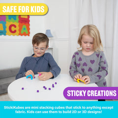 StickiKubes decorate notebooks, posters, or play surfaces with safe, reusable buildable art.