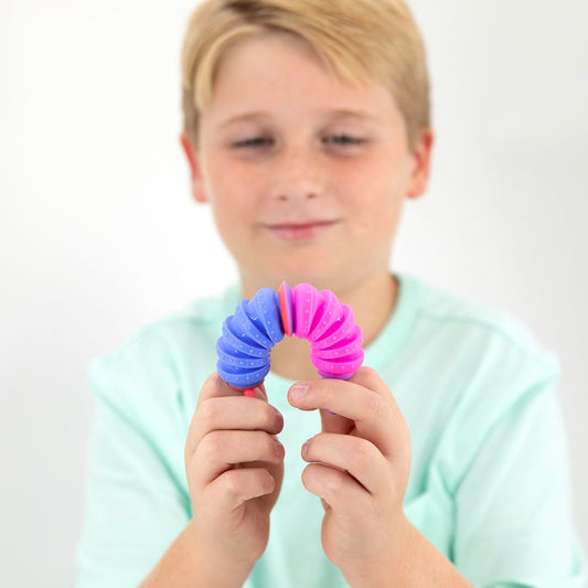 KRUMPLES Fidget Plungy squeeze-pop action demonstrates engaging sensory feedback