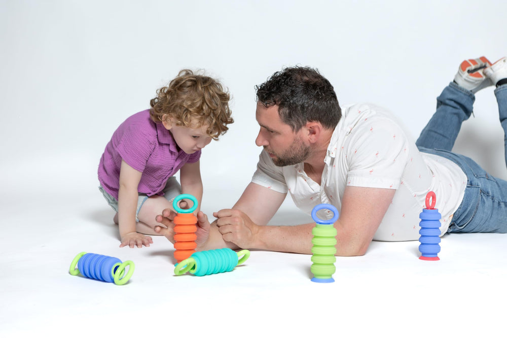 KRUMPLES Pully Teal mealtime use promotes sensory exploration and fine motor skills.