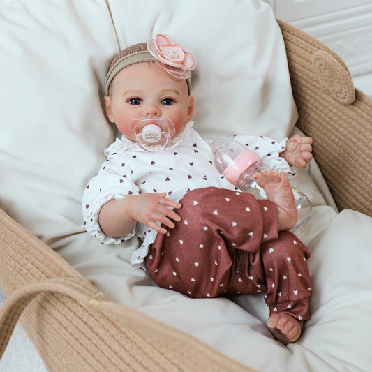 KSBD Reborn doll girl holding pose emphasizes weight and realism for nurturing play.