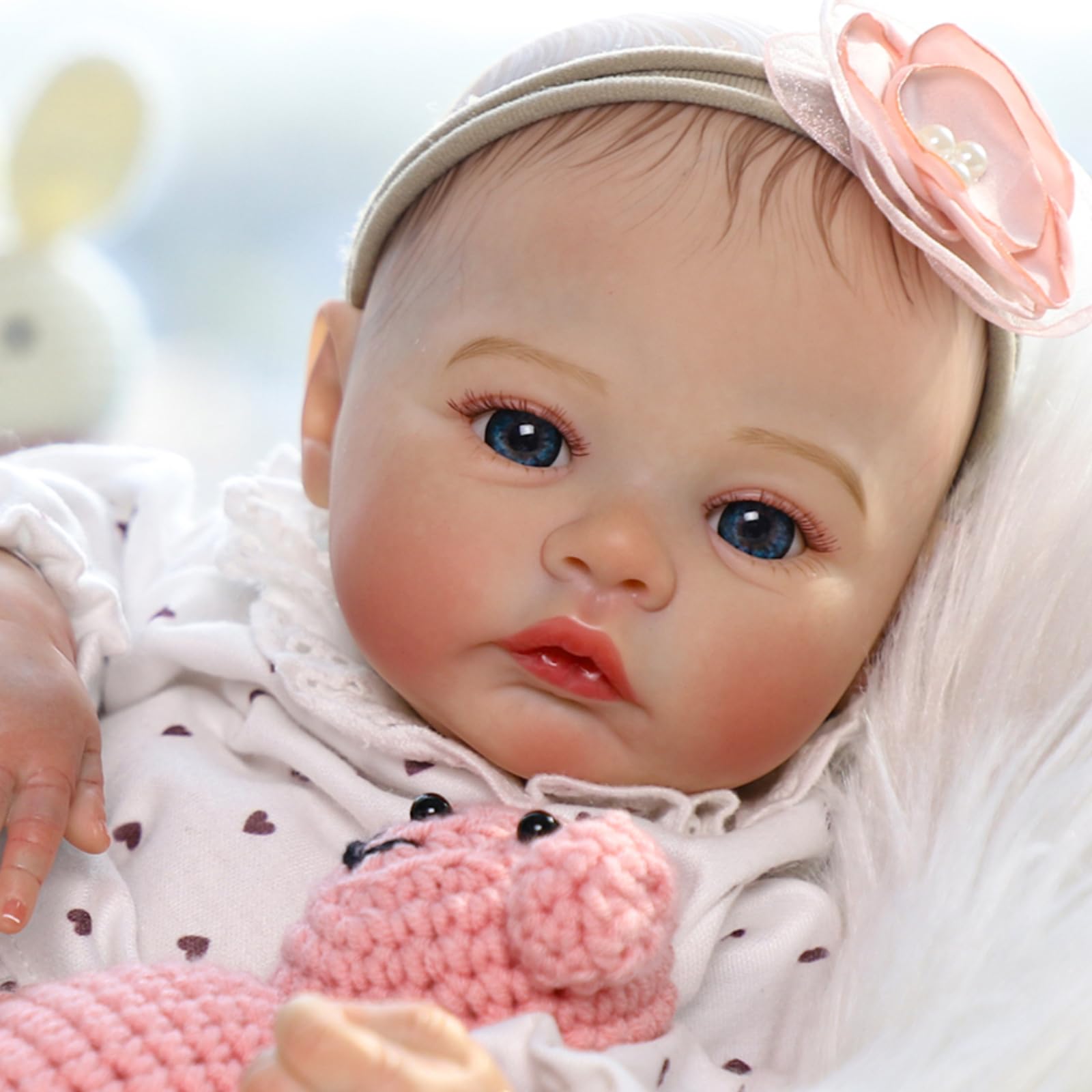 KSBD Reborn doll with soft cloth body offers cuddly tactile sensation during cuddling.