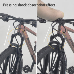 Kuasting blue mountain bike desk topper on a workspace surface