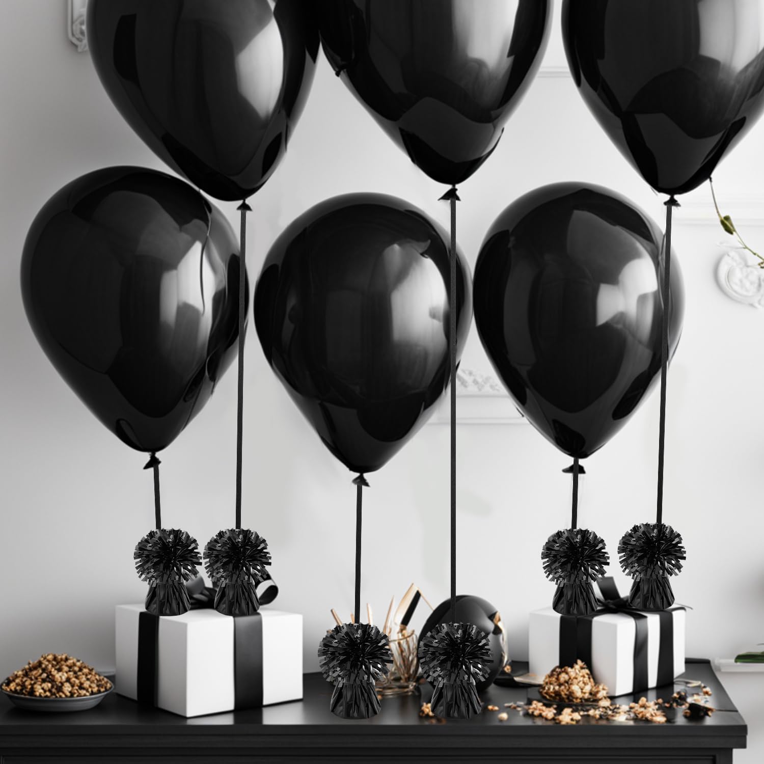 Close-up of KVCSYAW balloon weights used on a table decor setup