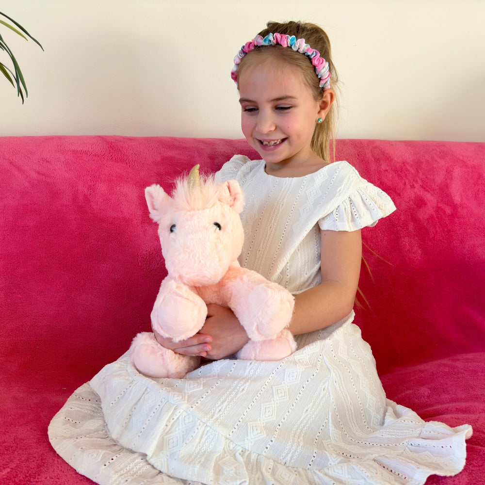 Laila and Lainey unicorn plush features durable stitching for hugs.