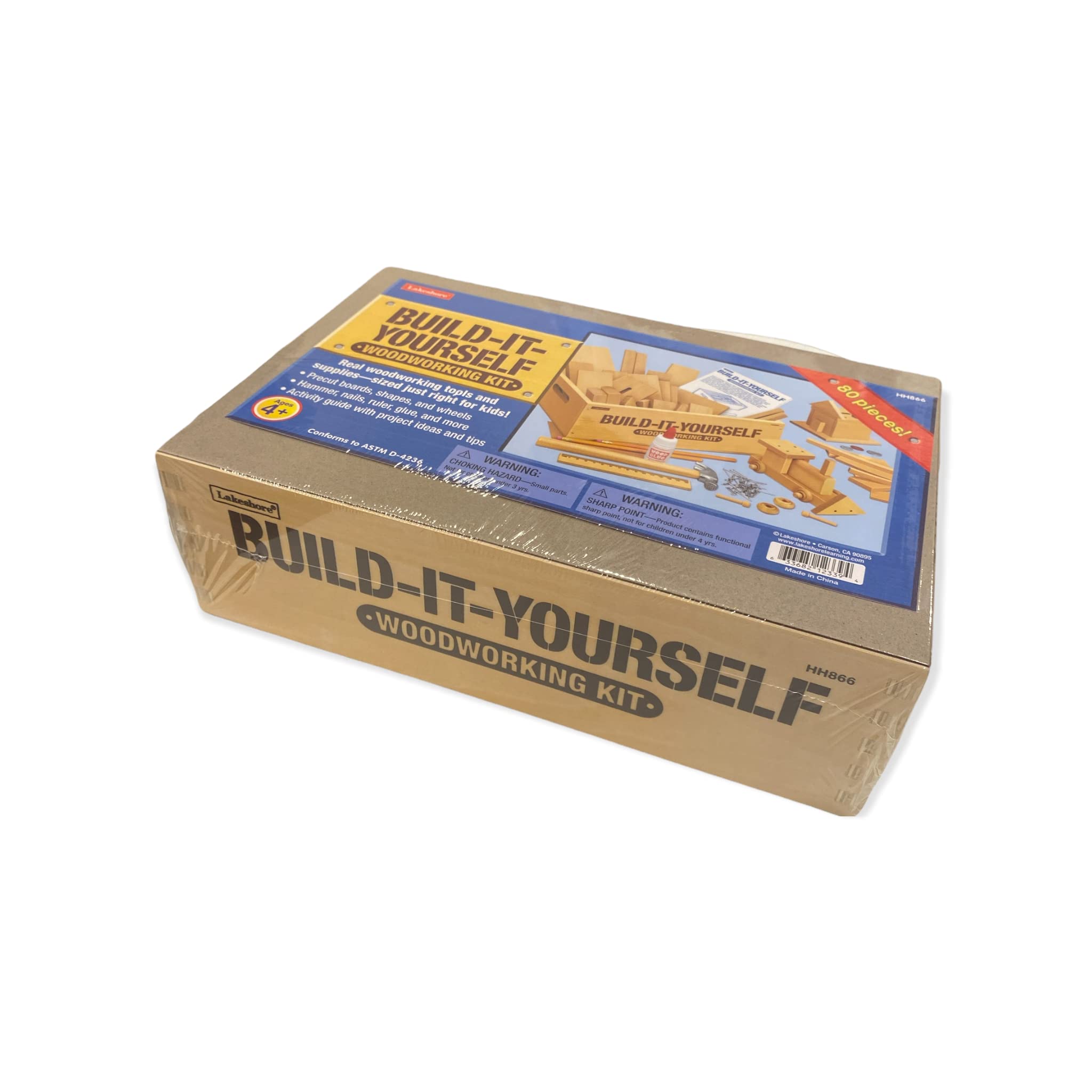 Lakeshore Build-It-Yourself Woodworking Kit kid using lightweight hammer for safe projects.